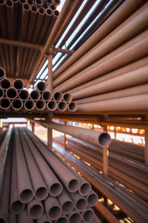 Various heavy duty scaffold tubes at lay down yard construction site, Sydney city Australia