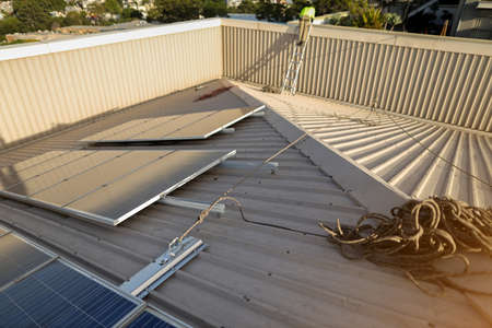 Solar panels installed on the roof of a residential building. Alternative energy source.