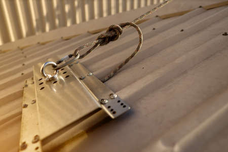 Close-up of a metal door lock with a chain. Selective focus.