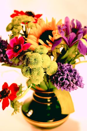 Bunch of flowers in a green vaseの写真素材