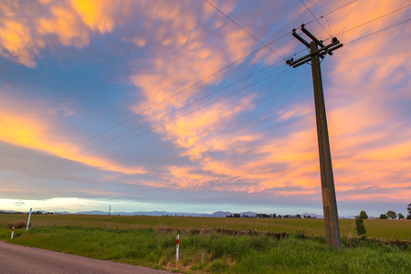 Sunset with colorful colors and grass fieldの写真素材
