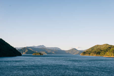 Beautiful sea at pier near mountain and harborの写真素材