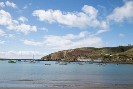 Blue sky with sea and green fieldの写真素材
