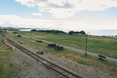 Blue sky with sea and green fieldの写真素材