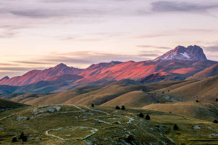 The dusk colors falling on the mountains before Monte Prena in the Apennine mountain range.