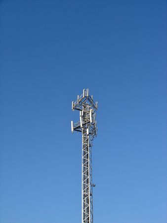 Mobile comunications antenna, for 2G (GSM) and 3G (UMTS/WCDMA) handsets in Europe. Antennas for 3 carriers share the same mast.の写真素材