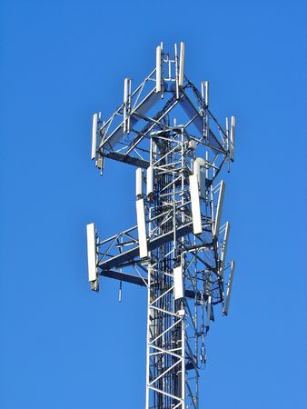 Mobile comunications antenna, for 2G (GSM) and 3G (UMTS/WCDMA) handsets in Europe. Antennas for 3 carriers share the same mast.の写真素材