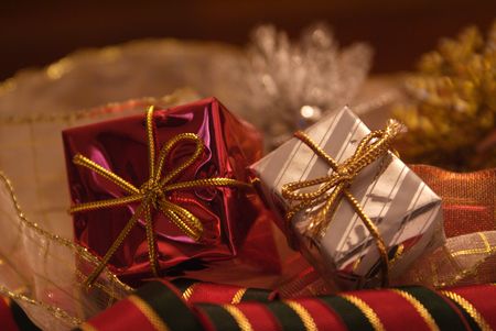 Christmas presents surrounded by seasonal ornaments with cute and powerful colors.の写真素材