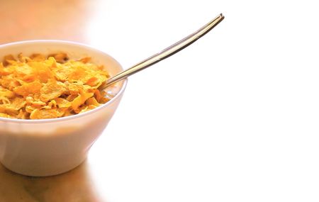 Healthy Cereals breakfast commonly eaten in the mornings, with a spoon.の写真素材
