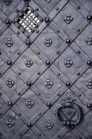 Ancient gray iron doorの写真素材