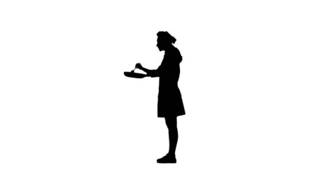Black silhouette of chef in a hat and cooks jacket stirring a dish in a pan and tasting it. Isolated on white background. For use in presentations, education manuals, design, etc.の写真素材