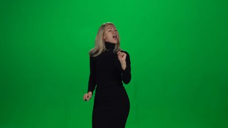 Happy businesswoman with silly dancing and singingの写真素材