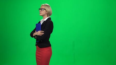 Businesswoman with tablet in hands. Green screenの写真素材