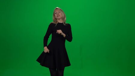Woman is dancing in a flying dress. Green screen.の写真素材