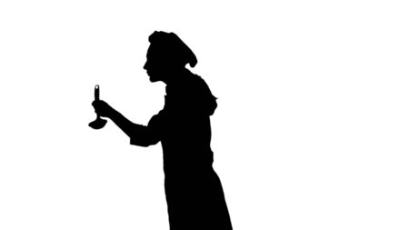 Black silhouette of professional cook tasting food from a ladle.の写真素材