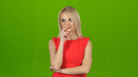 Blonde thought about question. Green screen studioの写真素材