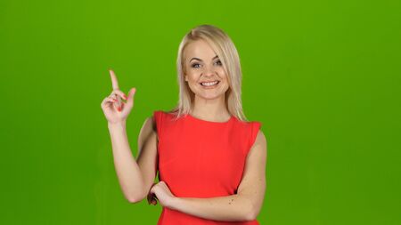 Blonde thought about question and found answer. Green screen studioの写真素材