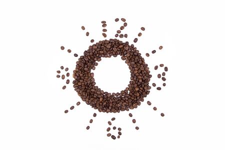 Coffee beans gathered are laid out in a circle with numbers symbolize the clock isolated on white...