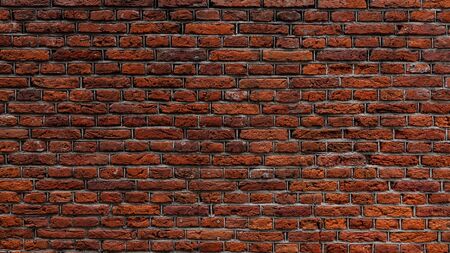 Abstract brick wall background. Red brick wall texture. An old brick wall showing close up detail