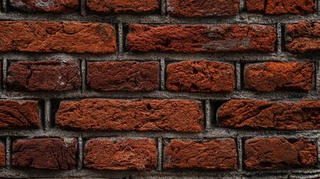 Abstract brick wall background. Red brick wall texture. An old brick wall showing close up detail