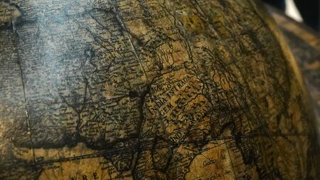 Old Miniature vintage globe. Close up.