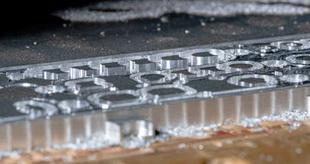 Metalworking CNC milling machine. Drilling steel. A drilling machine processes metal, cuts out a...