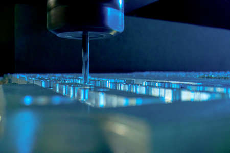 Metalworking CNC milling machine. Drilling steel. A drilling machine processes metal, cuts out a...