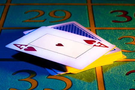 Ace of hearts in playing deck of cards. Playing cards close-up on gaming table in the casino. Stack...
