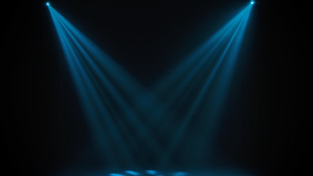 Blue theatrical beams of overhead light illuminating an empty dark stage. Bright neon spotlights and smoke on a black studio background. Light show, disco club lights.の素材 [FY310193466965]