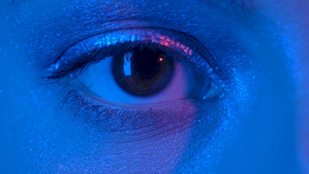 Womens eye with shiny make up with sparkles and arrow looking straight. Look of female eye with...