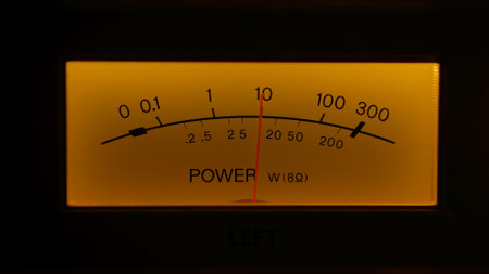 Yellow controls dashboard on an old analog radio. Close up of a scale with an arrow measuring signal power on vintage electronic sound audio device. Retro revival and nostalgia concept.の写真素材