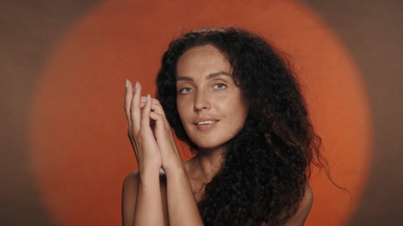Hand care and protection. A woman enjoys the softness, smoothness and silkiness of the skin of her...