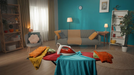 In the frame - a room with an ironing board and an iron on it. Someone forgot to turn it off. Safety...