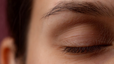 Portrait vision, macro camera shot of beautiful caucasian woman model face part. Closeup of female closed eye and face skin texture.の写真素材