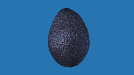 Healthy fruits and vegetables creative concept. Closeup studio shot of avocado isolated on blue...