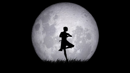 Portrait of professional dance artist. Beautiful female classical ballet dancer performing pirouette element on dramatic full moon background.の写真素材