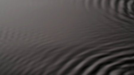 Beautiful monochrome deep light calm water surface with circles, abstract background, wallpaper...