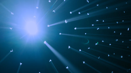 Close up shot of lights setup. Studio with black background, many dots with blue rays of light shine through the surface, blinding spotlight.の写真素材