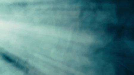 Abstract background of chaotically blending puffs of blue smoke on a black background. Realistic fog in blue neon light close up. Texture and abstract art. Copy space. HDR BT2020 HLG Material.の写真素材