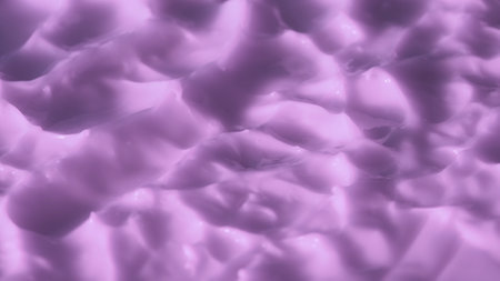 Uneven texture of cream in purple color. Face or body cosmetic product, close up. Creative concept of beauty industry advertisement.の写真素材