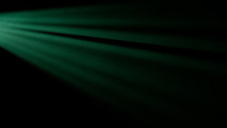 Studio shot of projector haze jalousie effect isolated on black background. Neon green light rays shining from side with smoke.の写真素材