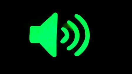 Symbols in waves concept advertising. Sign template isolated on black background. Neon green glowing speaker symbol.の写真素材