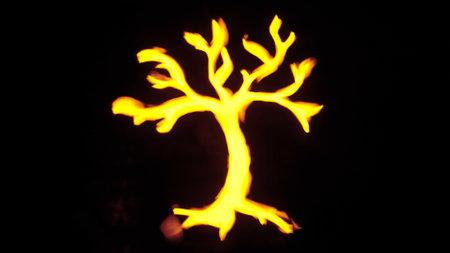Sign template isolated on black background. Neon glowing yellow tree symbol with branches and roots.の写真素材