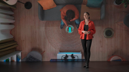 Woman presenting project on stage during meeting. Ceo businesswoman speaker presents startup smart...
