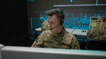 Group of security squad in control center. Military headquarters surveillance officers cyber police working in office, male technician giving instructions.の写真素材
