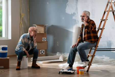 Senior Couple Taking a Break During Home Renovationの写真素材