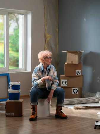 Contemplative Senior Amidst Moving Boxes