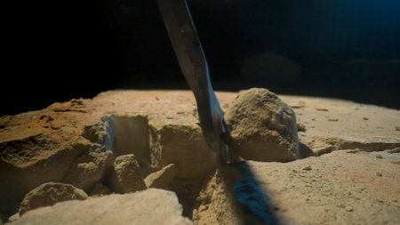 Detailed View of Drilling into Stony Ground with Visible Debrisの写真素材