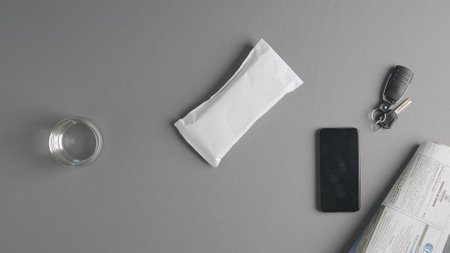 Minimalist Layout of Everyday Items on Gray Backgroundの写真素材