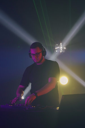 DJ Mixing Beats at a Club Event